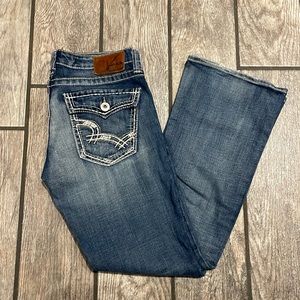 Big Star size 29R casey k low rise flare jeans. Dark wash. Some distressing.